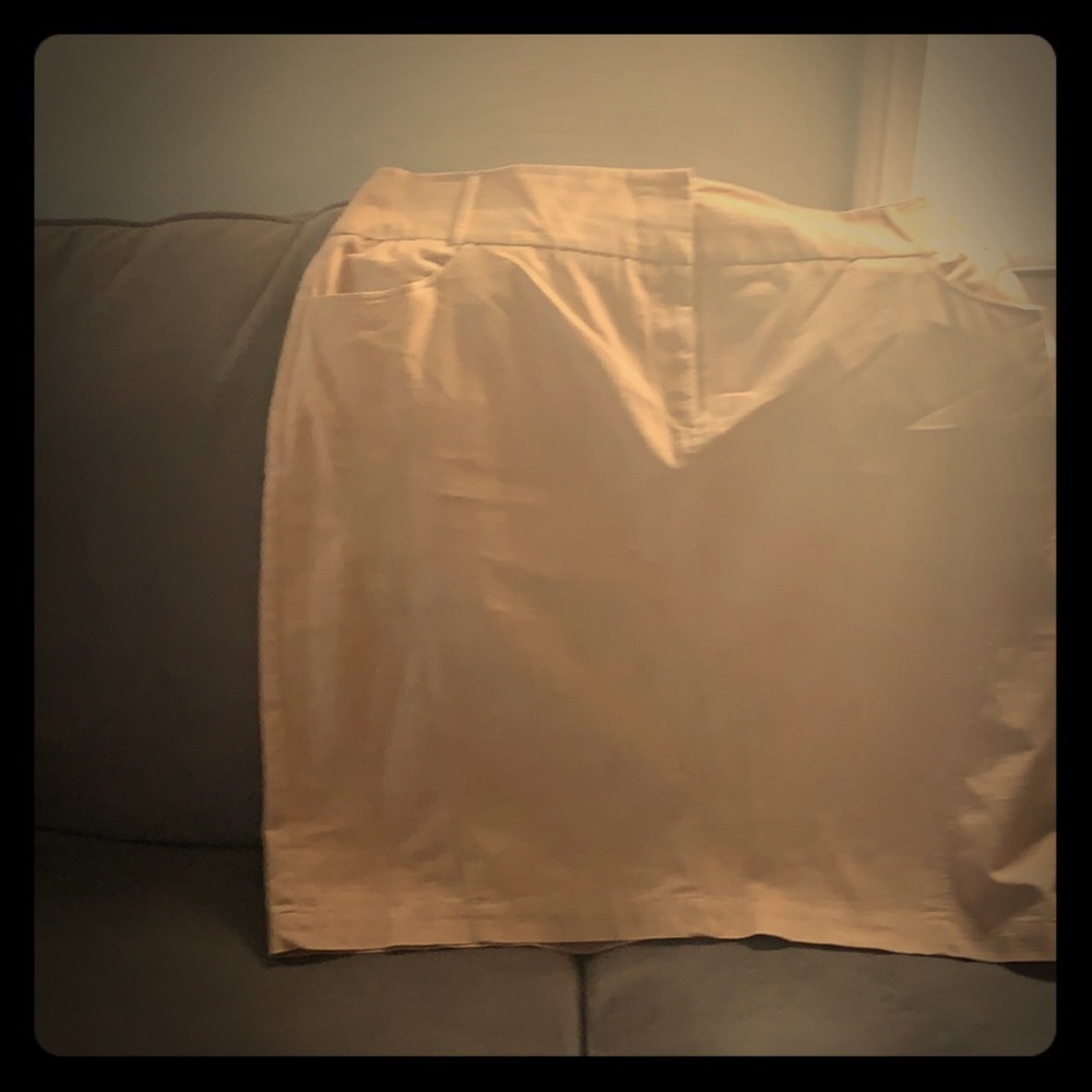Cream color skirt w/belt loops.